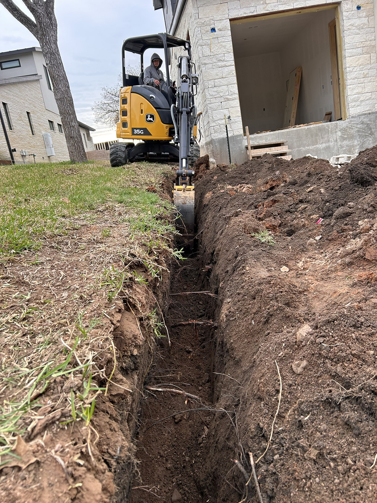 Excavation for underground utility conduit placement
